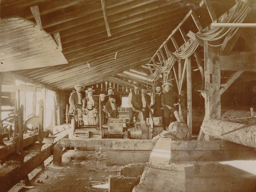 Employees winding paper inside Newton Falls paper mill
