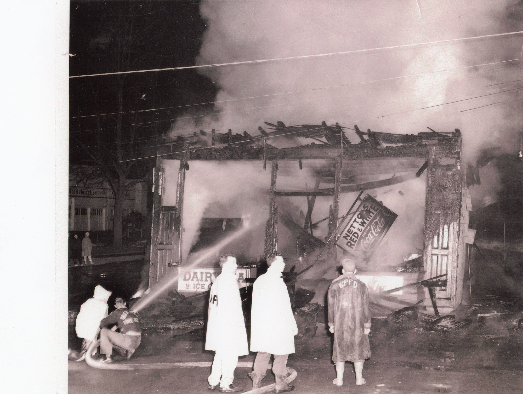 Volunteer fire department battles a fire in Dexter