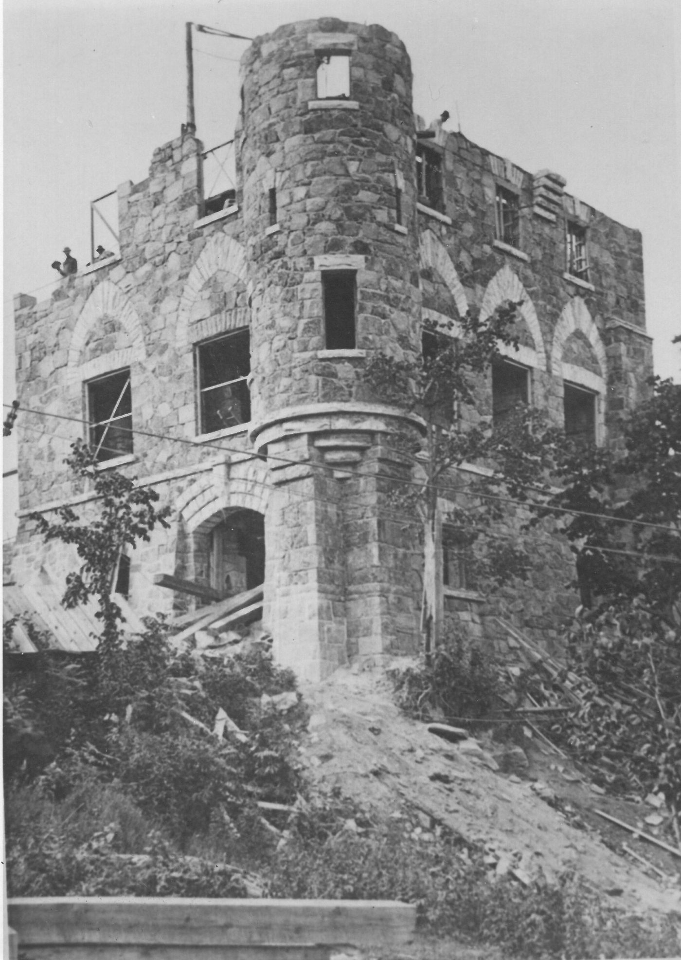 Stone mason constructing Singer Castle in Hammond