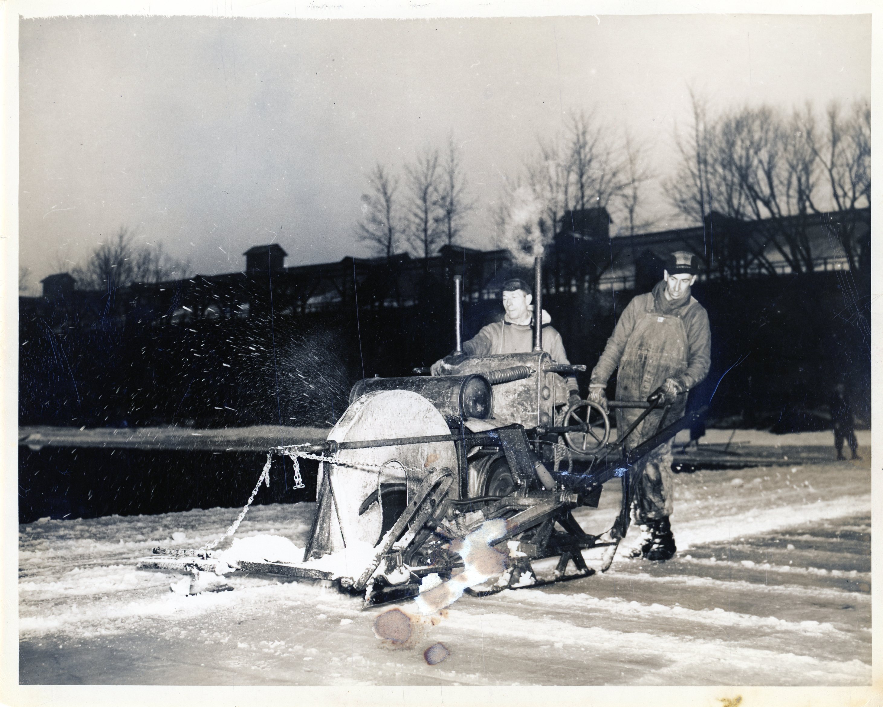 Cutting ice with kerosene powered ice saw in Carthage