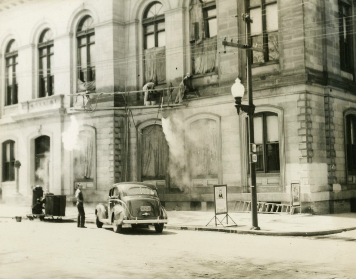 Steam washing the exterior of the post office in Ogdensburg