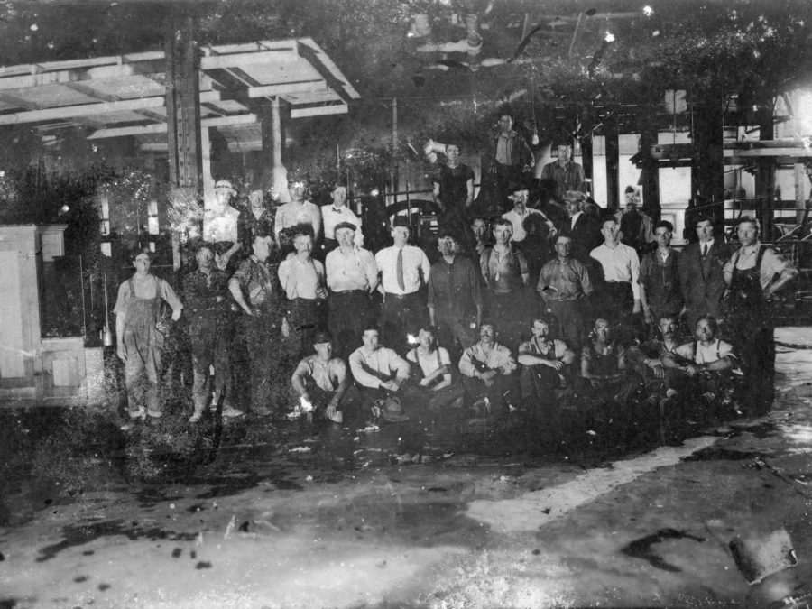 Longshoremen loading a onto a ship in the Port of Ogdensburg