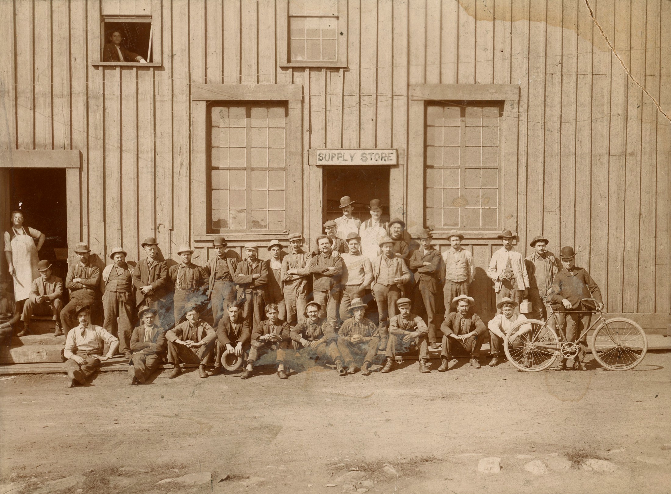 Employees in front of a supply store in Ogdensburg