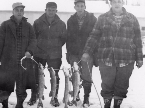 Fisherman with ice fishing catch in Morristown