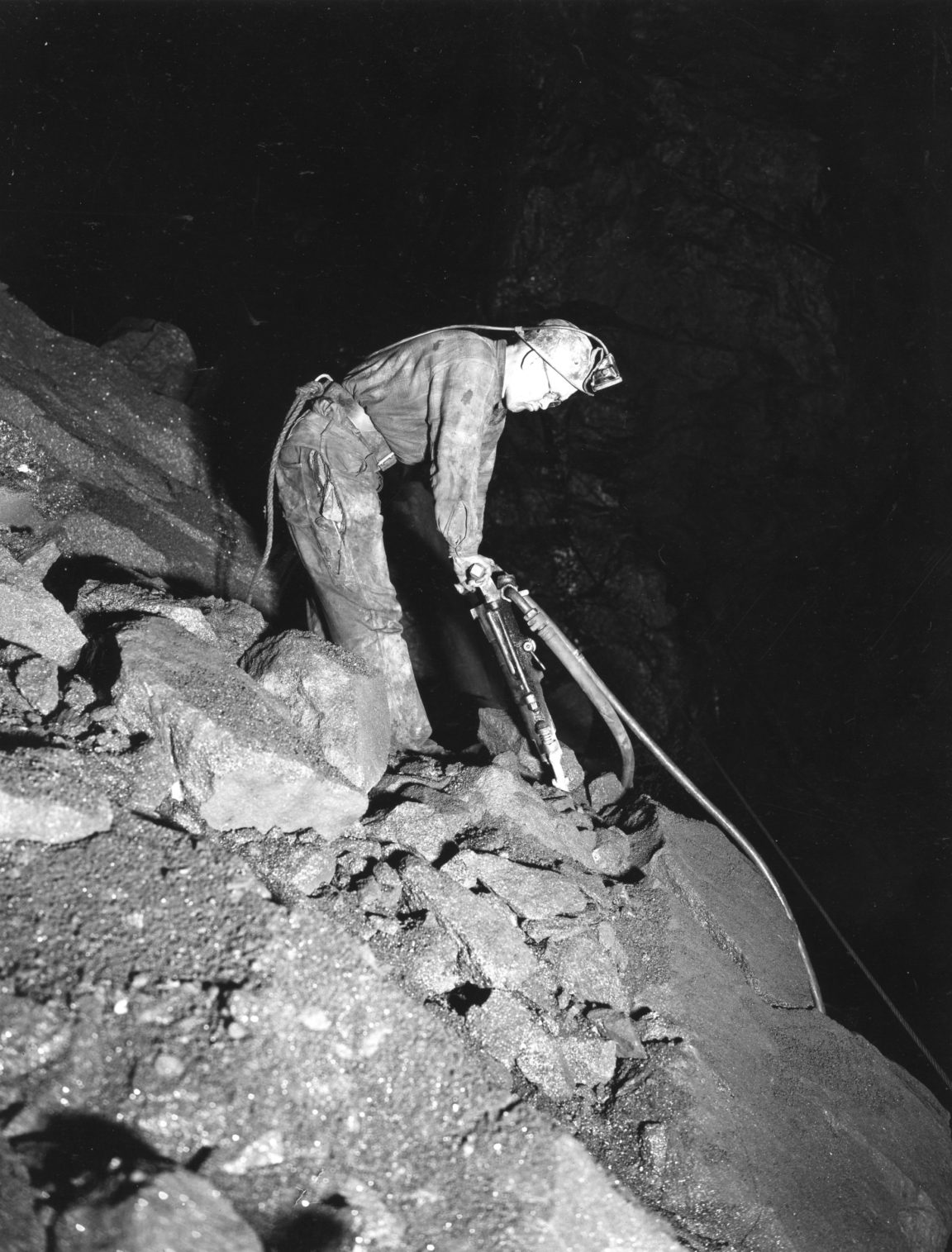 Drilling with a jackhammer in a Mineville mine