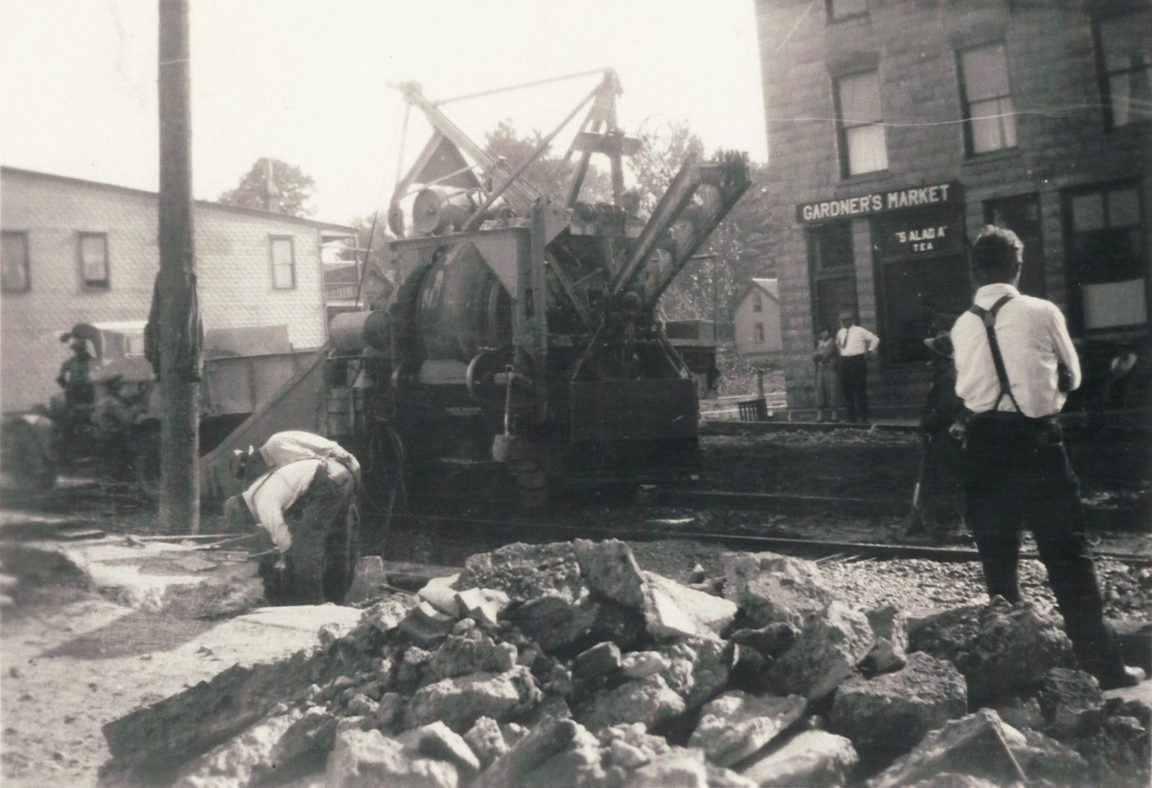 Working on concrete road through Harrisville