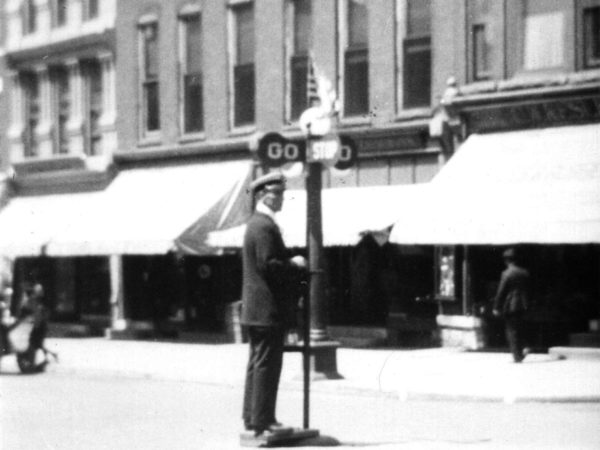 Policeman hand operating a traffic sign in Carthage