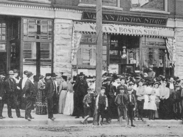 A crowd in front of Nolan’s Boston Store in Carthage