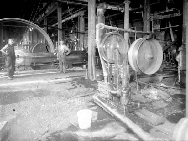 Workers inside Wilna Machine in Carthage