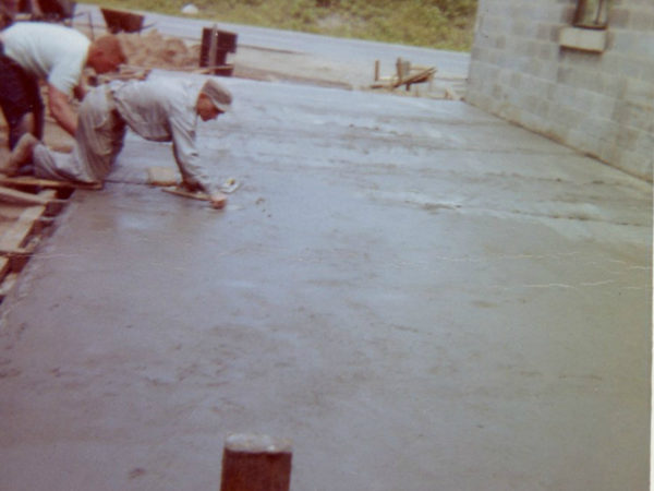 Smoothing the foundation of the Cranberry Lake Fire Hall in Cranberry Lake