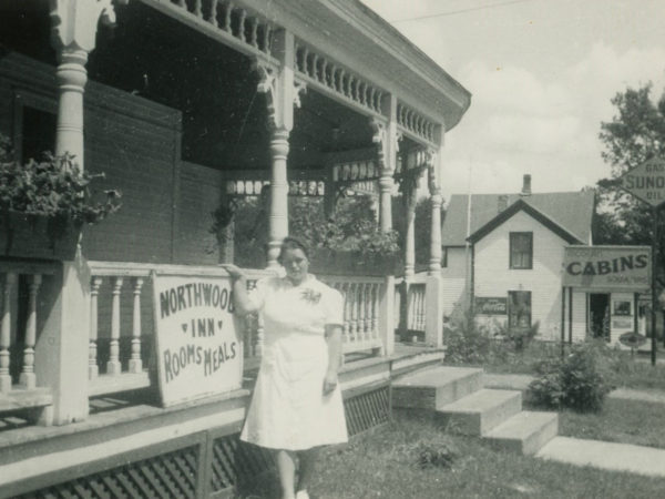 Sue Snyder in front of the NorthWood Inn in Cranberry Lake