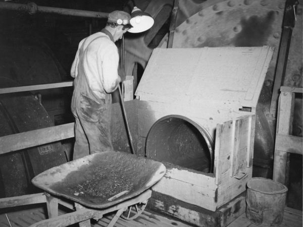 Shoveling iron ore slurry at Jones & Laughlin Steel Corporation in Benson Mines