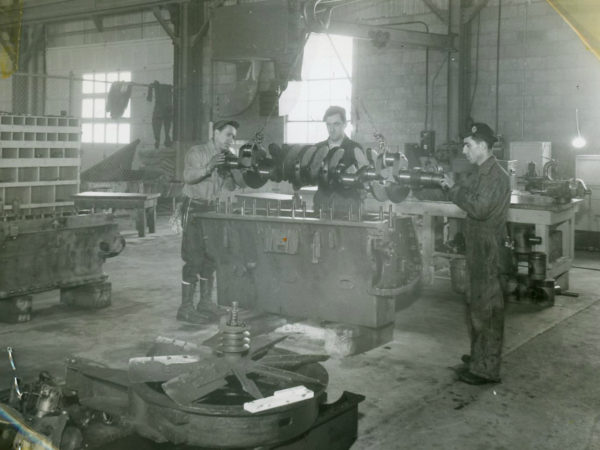 Inspecting a crank shaft in the garage of the Jones & Laughlin Steel Corporation in Benson Mines