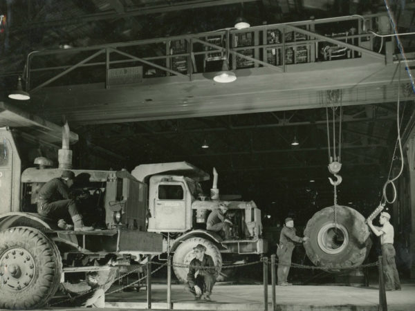 Mechanics working on trucks inside the garage of the Jones & Laughlin Steel Corporation in Benson Mines