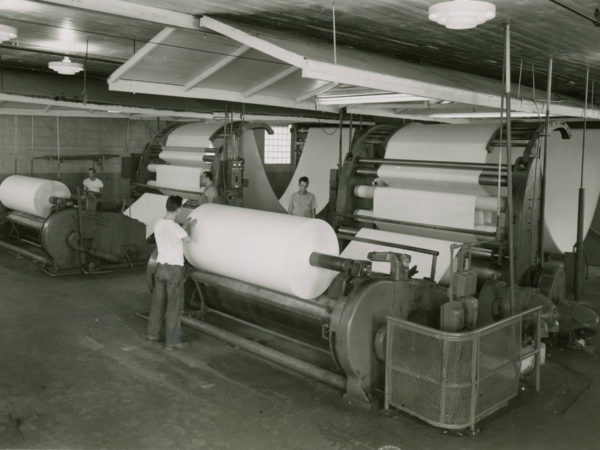 Measuring off paper inside the Newton Falls Paper Mill in Newton Falls