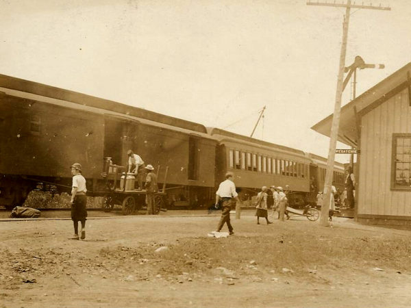 Loading milk cans at the train station in Oswegatchie