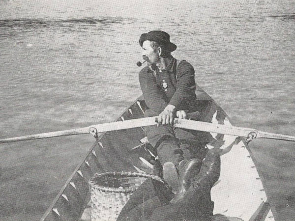 Bill Rasbeck at the oars of an Adirondack Skiff