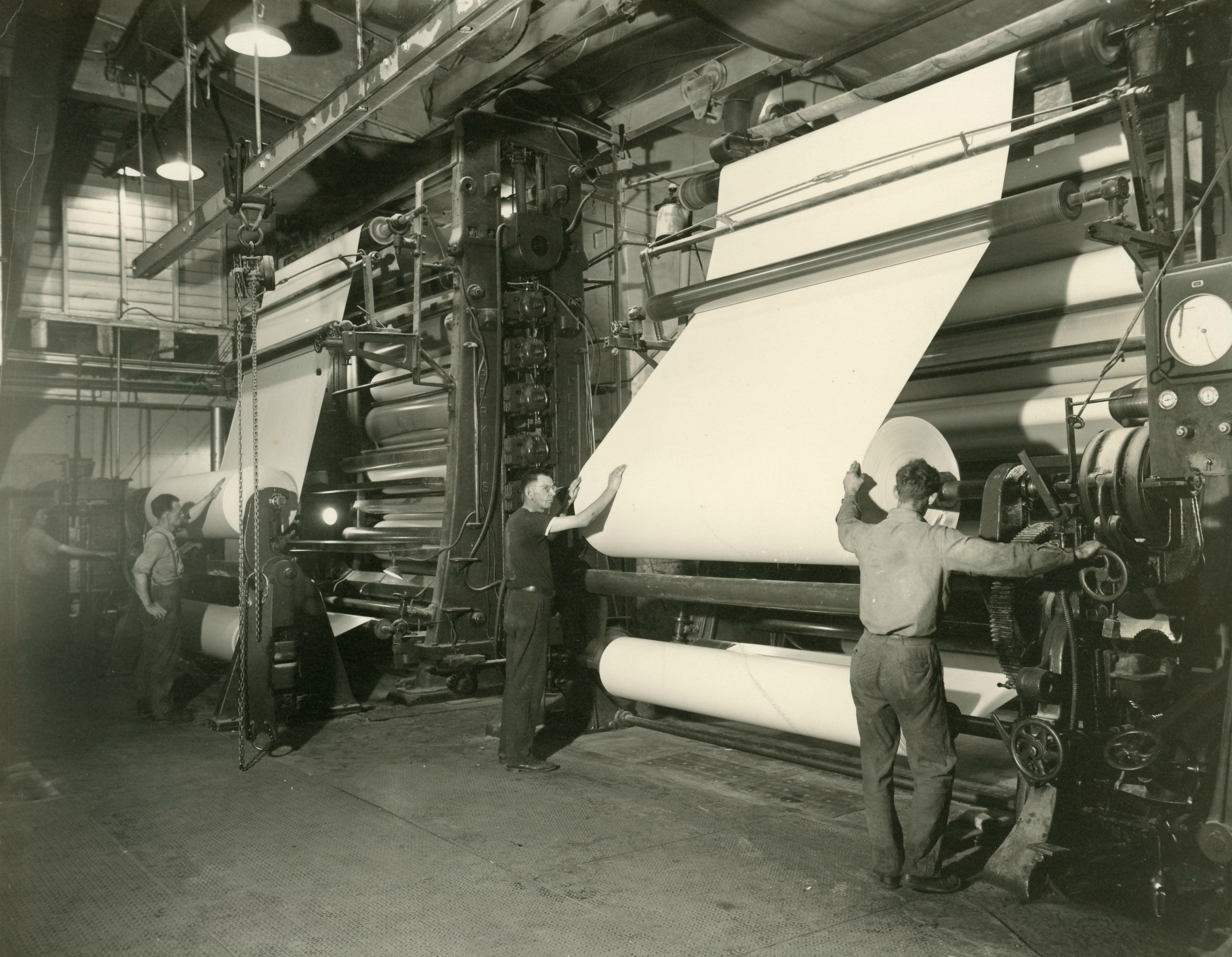 Working the calendar machines inside the Newton Falls Paper Mill in
