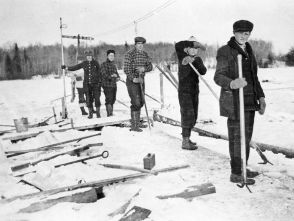 A row of ice harvesters on the Old Forge Pond