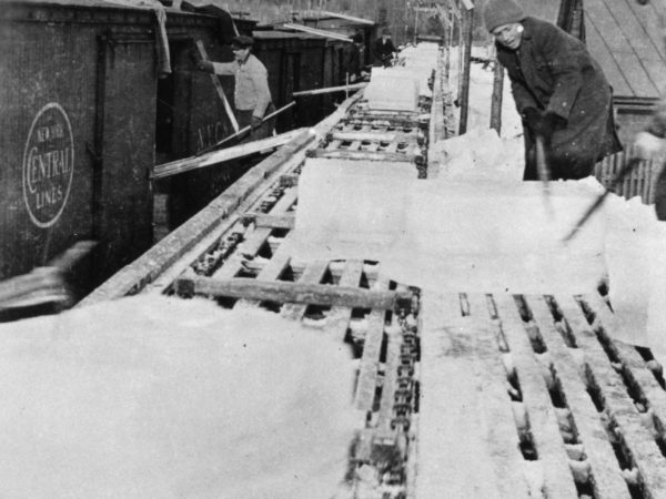 Loading ice blocks into train cars in Old Forge