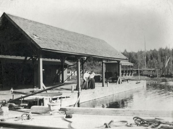 Forge House waitresses pose on the navigation dock on the Old Forge Pond