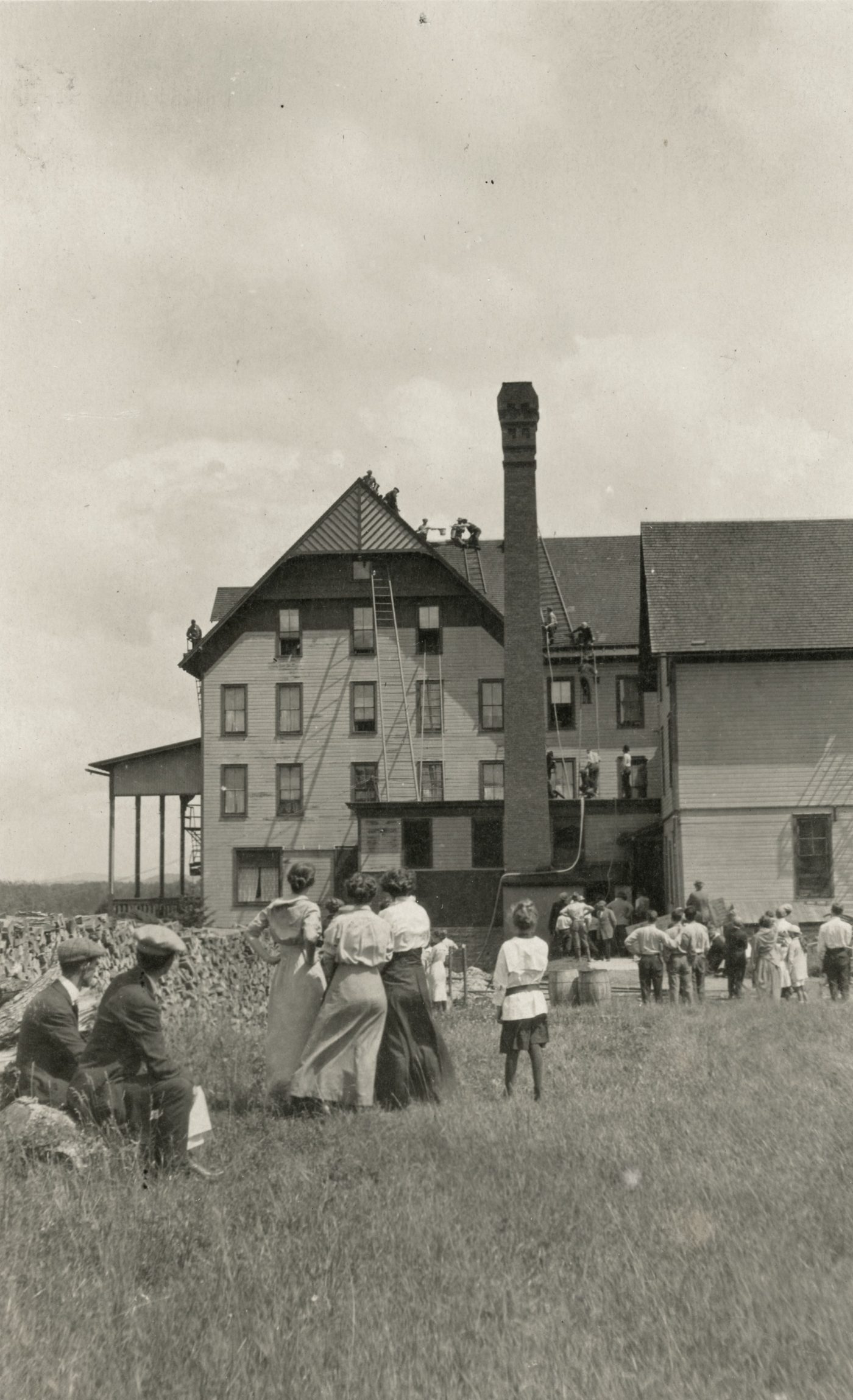 Firemen scale the Old House in Old