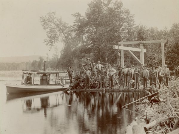 Eureka steam launch and loggers in the Town of Webb