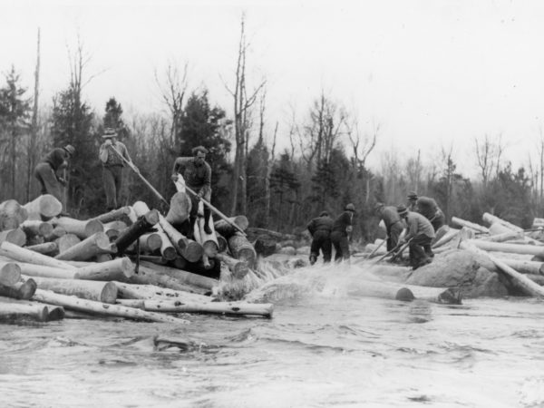 Breaking a log jam during spring drive in the Town of Webb