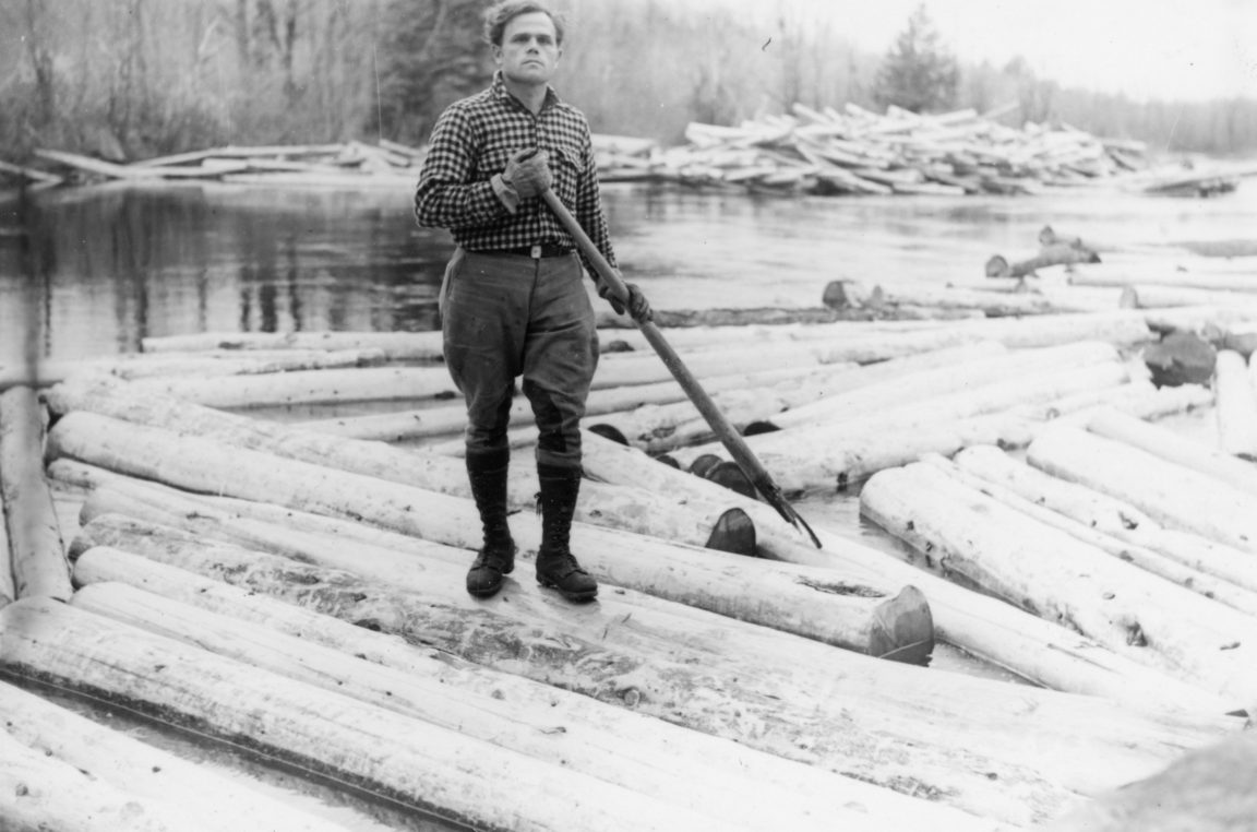 Logger with peavey in the Town of Webb
