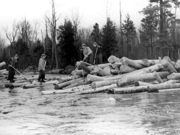 Five loggers breaking log jam in Town of Webb