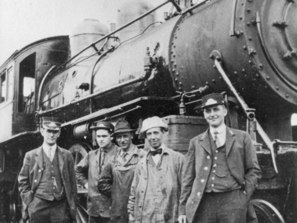 Railroad engine and crew in the Town of Webb