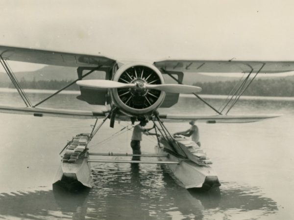 Carrying lumber by sea plane in the Town of Webb