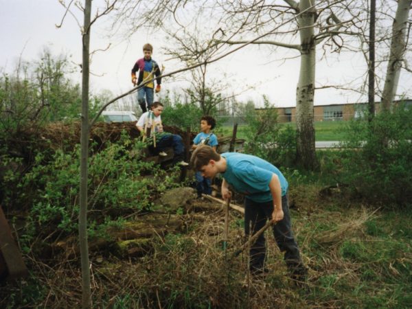 Children work to restore the old meeting house in East De Kalb