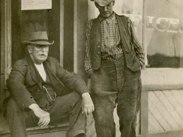 Conversation on steps of the post office in De Kalb Junction