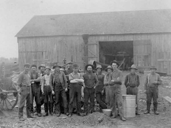 Farm workers on the Ira Poor farm in the Town of De Kalb