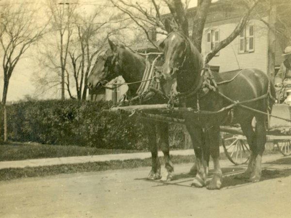 Farmer with milk can in the Town of De Kalb