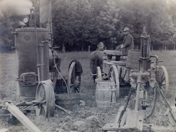 Road crew operating a steam drill in the Town of De Kalb