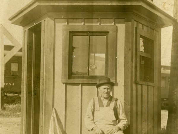 Flagmen in front of his office in De Kalb Junction