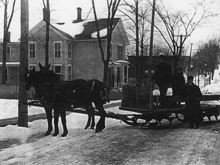 Two men and their horses in De Kalb Junction