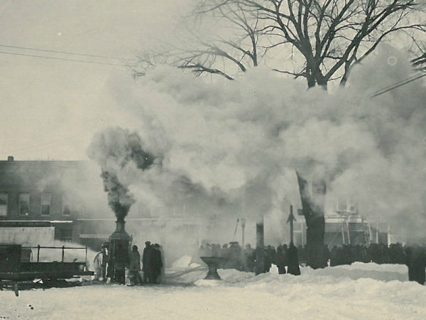 Firefighters battle the Spaulding fire using steam pumper in Canton