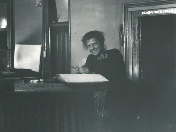 Bookkeeper at the counter of the First National Bank in Canton