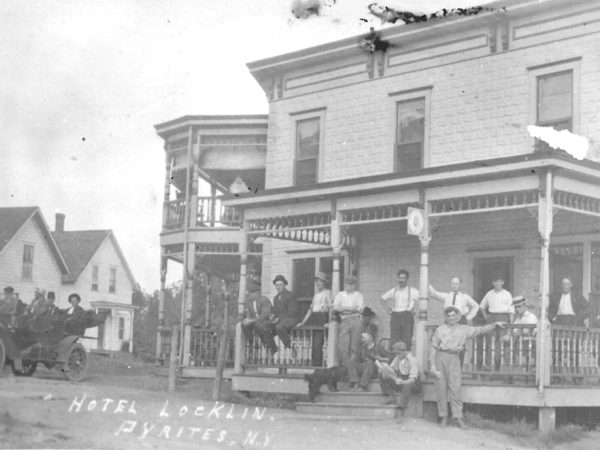 People on the porch of Hotel Locklin in Pyrites