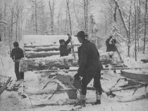 Loading logs onto a bobsled in Canton