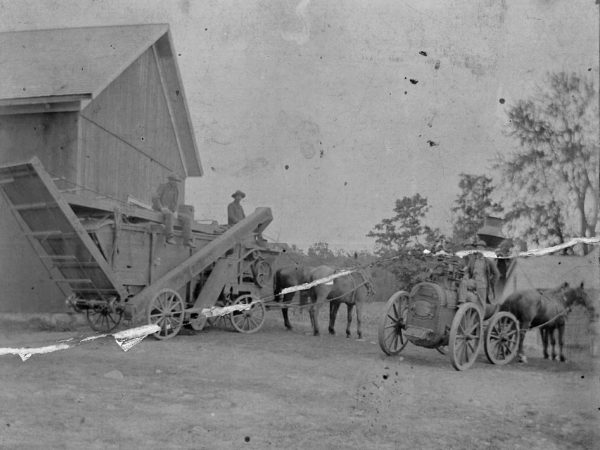 Threshing crew and harvest machinery in Canton