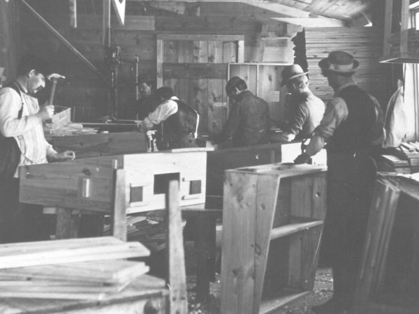 Men at work inside Van Dwyer Furniture Works in Gouverneur