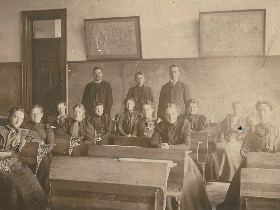 Teachers in front of a school in Waddington