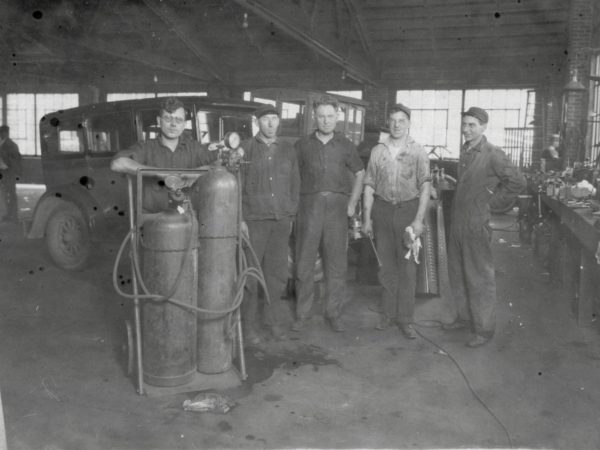 Employees in the Spooner Campbell Company Garage in Gouverneur