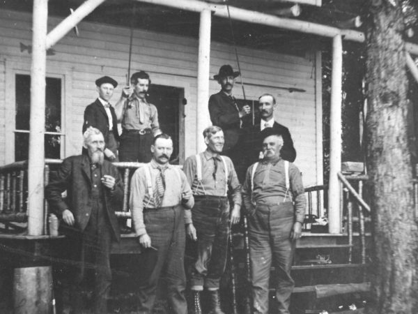 Adirondack hunting guides in front of Howland’s Camp in the Adirondacks