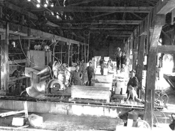 Workers cutting marble in Gouverneur