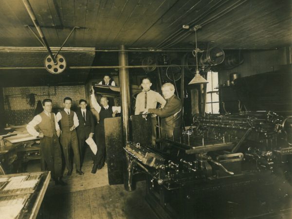 Employees in the office of the Commercial Advertiser in Canton